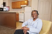 Joanne H. Murray enjoys the one-bedroom apartment she moved into late last month on North Side with the help of several agencies.