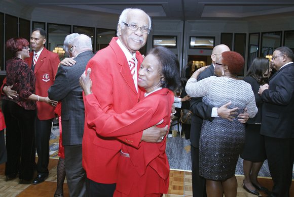 Alga and Earlene Evans, left, join other couples in dancing to a love song at the 16th Annual Valentine Gala ...