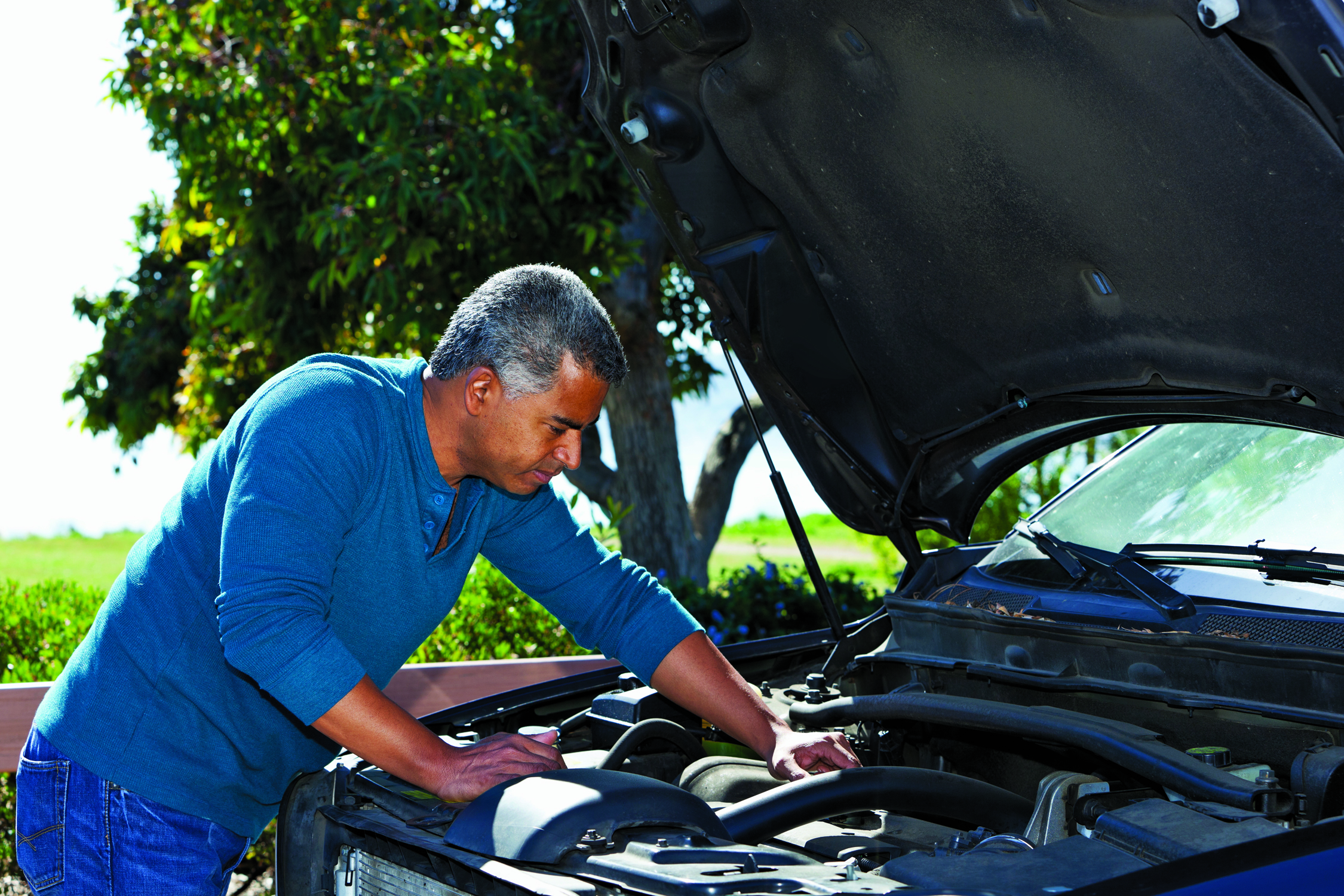 He is Mending his car