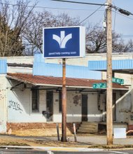 Bon Secours’ blue banner promises “good help coming soon” in the form of a new wellness center at the site of a former gas station and car wash at 2600 Nine Mile Road in Church Hill.