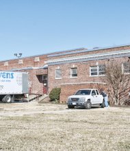 Movers are in place at Elkhardt Middle School to load and haul all school materials across town to Clark Springs Elementary School last Friday.