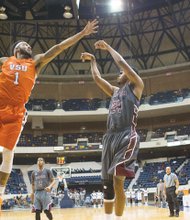 High-flying Virginia State University forward Tyrece Little, left, shown in the 2015 Freedom Classic, was named the CIAA’s Defensive Player of the Year. Here, he blocks a shot taken by Virginia Union University’s Ronald Whaley.