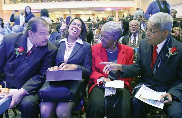 Former Richmond City Council colleagues who brought black political power to City Hall in 1977 take part in a recognition ceremony that Mayor Dwight C. Jones hosted Wednesday night at The Hippodrome Theater in Jackson Ward. Right, Henry W. “Chuck” Richardson chats with Claudine McDaniel, who stood in for her mother, the late Claudette Black McDaniel, Willie J. Dell and Henry L. Marsh III, who became the city’s first African-American mayor with the votes of his colleagues. 