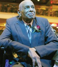 Former Richmond City Council colleagues who brought black political power to City Hall in 1977 take part in a recognition ceremony that Mayor Dwight C. Jones hosted Wednesday night at The Hippodrome Theater in Jackson Ward. Right, Henry W. “Chuck” Richardson chats with Claudine McDaniel, who stood in for her mother, the late Claudette Black McDaniel, Willie J. Dell and Henry L. Marsh III, who became the city’s first African-American mayor with the votes of his colleagues. Left, Walter T. Kenney, the fifth honoree, listens to the program with a reflective expression.
