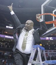 VSU women’s basketball coach James Hill Jr. exuberantly signals his team is No. 1.