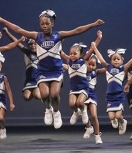 Cheerleaders from Richmond’s John B. Cary Elementary School leap in mid-cheer during a routine performed Feb. 28 at Generation Dream 2015. Monty Jones also shows off his skills dancing to the rhythms of Drums No Guns. The music, spoken word, dance and arts event was hosted by the Richmond Peace Education Center to promote the ideals of Dr. Martin Luther King Jr. Location: Henrico Theater in Highland Springs.