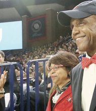 New University of Richmond President Ronald A. Crutcher and his wife, Betty, receive a standing ovation at his welcome ceremony at the Robins Center.