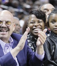 National radio host Tom Joyner takes in a game with CIAA Commissioner Jacquie McWilliams and her daughter, Semone Carpenter, after broadcasting his “Tom Joyner Morning Show” from the CIAA Fan Fest at the nearby Charlotte Convention Center