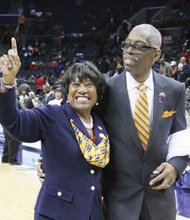 Virginia State University’s interim President Pamela V. Hammond and her husband, Gary John Hammond, celebrate VSU’s win over Lincoln University for the women’s title