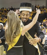 Virginia Commonwealth University students Frankie James and Victoria Edwards ebulliently accept crowns during their coronation as 2015 VCU Homecoming King and Queen at the Siegel Center. 