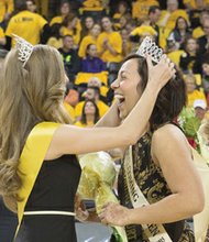 Virginia Commonwealth University students Frankie James and Victoria Edwards ebulliently accept crowns during their coronation as 2015 VCU Homecoming King and Queen at the Siegel Center. 