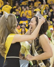 Virginia Commonwealth University students Frankie James and Victoria Edwards ebulliently accept crowns during their coronation as 2015 VCU Homecoming King and Queen at the Siegel Center. 