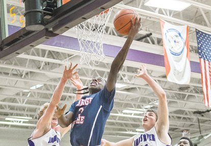 George Wythe High School’s Maliek White stretches toward the hoop in a January basketball game against Chesterfield’s James River High School.