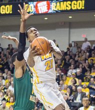 James Haskins/Richmond Free Press
Virginia Commonwealth University’s Treveon Graham catapults toward the basket as the Rams defeated George Mason University 71-60 last Saturday at the Siegel Center.
