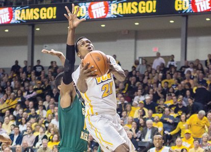 James Haskins/Richmond Free Press
Virginia Commonwealth University’s Treveon Graham catapults toward the basket as the Rams defeated George Mason University 71-60 last Saturday at the Siegel Center.