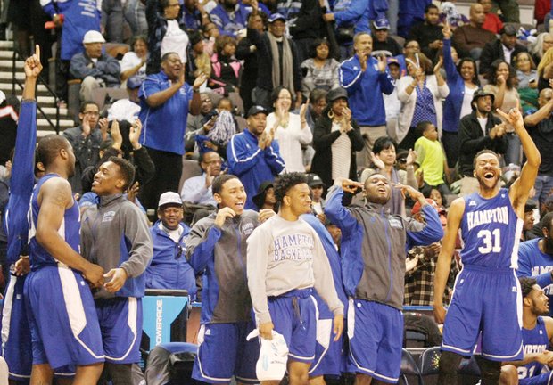 Hampton University’s men’s basketball team, shown above after winning Saturday’s MEAC Tournament in Norfolk, will suit up Thursday night against No. 1 Kentucky in NCAA Tournament play in Louisville.