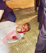 Bloodied University of Virginia student Martese Johnson is held down by an ABC agent after being slammed to the ground last week outside a Charlottesville pub.