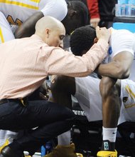 Virginia Commonwealth University Coach Shaka Smart consoles senior Treveon Graham after the team’s 75-72 overtime loss in the NCAA Tournament to Ohio State University last Thursday.