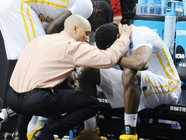 Virginia Commonwealth University Coach Shaka Smart consoles senior Treveon Graham after the team’s 75-72 overtime loss in the NCAA Tournament to Ohio State University last Thursday.