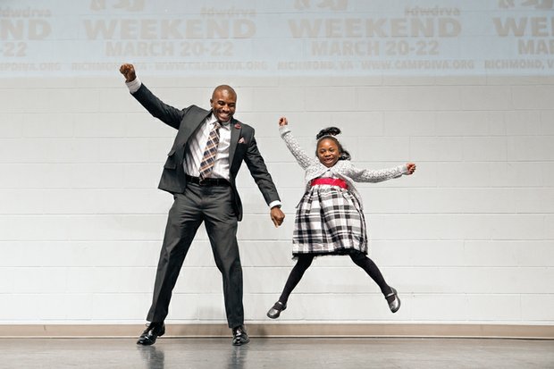 Top This Dad!

Michael Walker and his exuberant, high-flying daughter, Sage, 6, share the stage Sunday at the eighth annual
Date With Dad Dinner and Dance at the Trinity Family Life Center on North Side. The event, organized locally by CAMP DIVA, was part of Date With Dad Weekend 2015, which is intended to draw dads and daughters closer together.