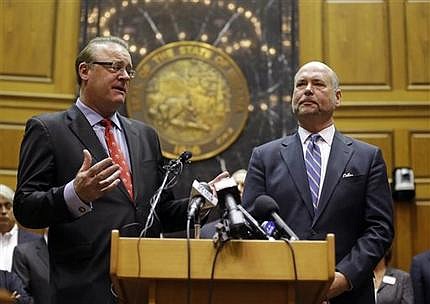 Indiana Senate President Pro Tem David Long, left, (R-Fort Wayne) and House Speaker Brian C. Bosma (R-Indianapolis) announce changes to the state's new religious objections law during a press conference in the House chamber at the Statehouse in Indianapolis, Thursday, April 2, 2015. The measure has faced criticism it could allow discrimination against lesbians and gays. (AP Photo/Michael Conroy) 