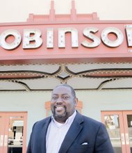 Pastor Donald Coleman stands in front of the Robinson Theater Community Arts Center, where the East End Fellowship he co-founded in 2008 worships each Sunday.