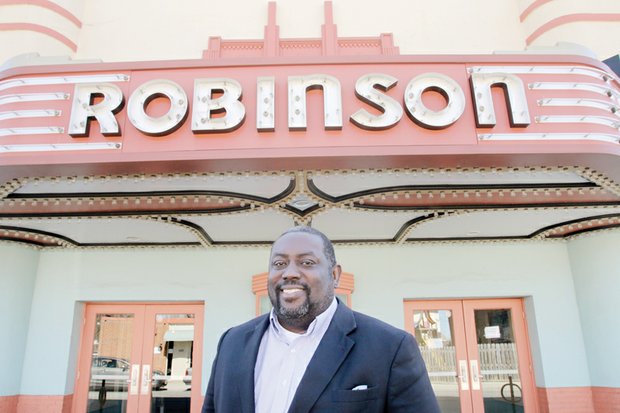 Pastor Donald Coleman stands in front of the Robinson Theater Community Arts Center, where the East End Fellowship he co-founded in 2008 worships each Sunday.