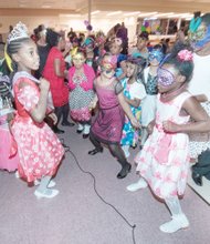 Students sporting colorful masks, tiaras and crowns hit the dance floor at the festive family event held at Second Baptist Church of South Richmond.