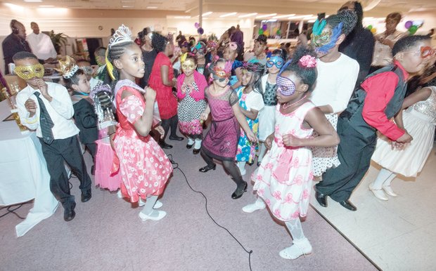 Students sporting colorful masks, tiaras and crowns hit the dance floor at the festive family event held at Second Baptist Church of South Richmond.