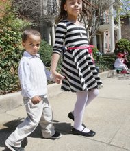 Stepping out in style
Three-year-old Emmanuel Frias strolls Sunday with big sister Isabella, 8, during Easter on Parade. The youngsters and their parents were among thousands of people who turned out for the annual holiday event on Monument Avenue.