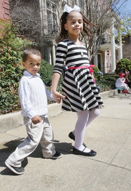 Stepping out in style
Three-year-old Emmanuel Frias strolls Sunday with big sister Isabella, 8, during Easter on Parade. The youngsters and their parents were among thousands of people who turned out for the annual holiday event on Monument Avenue.