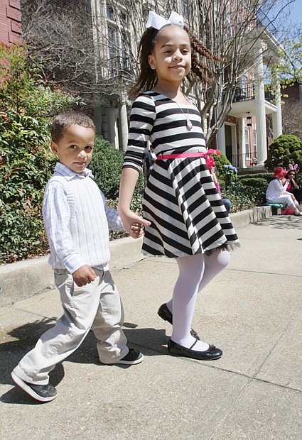 Stepping out in style
Three-year-old Emmanuel Frias strolls Sunday with big sister Isabella, 8, during Easter on Parade. The youngsters and their parents were among thousands of people who turned out for the annual holiday event on Monument Avenue.