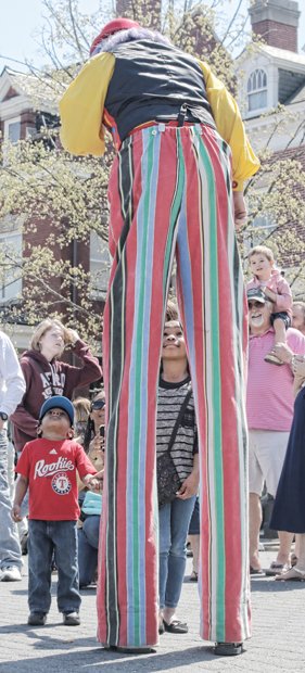  James McGee and his sister, Jazlyn, check out Christopher the Clown, who towered over the crowd as he entertained them.