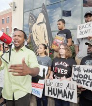 Muhiydin D’Baha leads protesters Wednesday outside of the North Charleston, S.C., city hall in calling for justice in the death of unarmed Walter L. Scott by former officer Michael T. Slager.