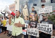 Muhiydin D’Baha leads protesters Wednesday outside of the North Charleston, S.C., city hall in calling for justice in the death of unarmed Walter L. Scott by former officer Michael T. Slager.