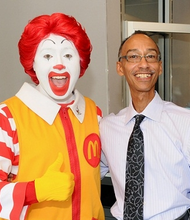 Black McDonald's Operations Association member Keith Allen and Ronald McDonald.