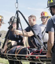 Richmond firefighters from Engine and Truck Company No. 1 take advantage of the spring weather to train in rescue methods last Saturday. Location: Chim- borazo Park in the city’s East End near the fire station at 308 N. 24th St. The firefighters practiced what is called a Stokes Basket Evolution, using the park’s steep, hilly terrain to train in retrieving victims from hard-to-reach locations.