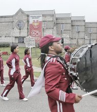 marching band members entertain the audience. The commemoration began at the site of the former slave-holding pen known as Lumpkin’s Jail in Shockoe Bottom, where VUU traces its origins. The American Baptist Home Mission Society began classes in 1865 to educate freed slaves. Gov. Terry McAuliffe, who spoke at the Shockoe Slip ceremony, urged the audience there to “build upon what happened 150 years ago.” 