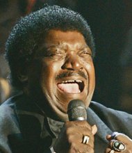 Percy Sledge performs after accepting his award during the Rock and Roll Hall of Fame induction ceremony in 2005 in New York.