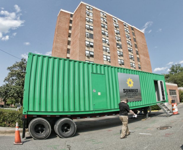 This large generator was set up Tuesday to provide power to residents of the 11-story Fay Towers. The electricity went out Sunday after squirrels damaged a power line leading into the building. 