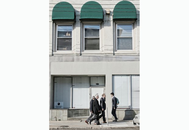 Pedestrians walk by the new home of Muhammad Mosque No. 24 at 408 E. Main St. in Downtown. No signs adorn the building to call attention to its new use as a place of worship.