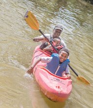 Earth Day fun
Brothers Jamon, 9, and Justin Jones, 2, enjoy
a kayak ride as their grandfather, Wayne Samuels, provides paddle power. The family fun took place last Saturday on
the James River at Great Shiplock Park in Shockoe Bottom during activities
at the city’s annual Earth Day celebration. The actual worldwide Earth Day was April 22 and is designed
to foster environmental protection.