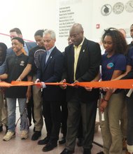 Chicago Mayor Rahm Emanuel (center), Ald. Willie Cochran (20th Ward) (center-right) and Cong. Bobby Rush (Dist.-1st) (far right) are joined by enthusiastic youth squash players for the ribbon cutting ceremony to open the MetroSquash academic and squash center located at 6100 S. Cottage Grove Ave.