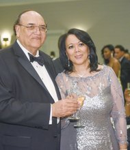 Virginia Union University President Dr. Claude G. Perkins and his wife, Cheryl E. Perkins, enjoy festivities at the VUU Scholarship Gala and Masquerade Ball. The black- tie fundraiser was held April 24 at a Downtown hotel.