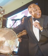 Mayor Dwight C. Jones, a VUU alumnus and official host of the event, draws the name of the winner of the 2015 BMW during the National Alumni Association’s raffle during the gala.