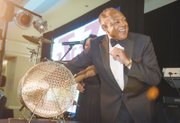 Mayor Dwight C. Jones, a VUU alumnus and official host of the event, draws the name of the winner of the 2015 BMW during the National Alumni Association’s raffle during the gala.