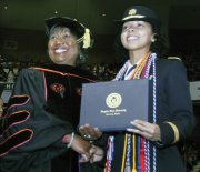 Interim Virginia State University President Pamela V. Hammond congratulates Arrisa Hanson as the top-ranking student in the graduating class. Ms. Hanson, who majored in psychology, earned a 4.0 GPA.