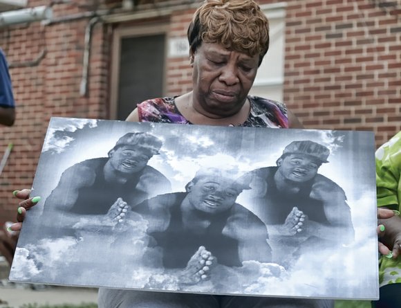 Community leaders, residents march in Mosby Court for peace