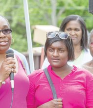 Members of Martin “Marty” Cobb’s family thank volunteers for their efforts constructing the playground. They are, from left, Marty’s aunt, Arleen Pitchford; his sister, Qutaya Cobb; and his grandmother, Mary Pitchford.