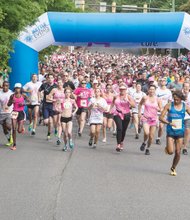 Race for the Cure
Runners flood through the starting gate on Byrd Street in downtown to launch the Susan G. Komen race for the Cure. the annual 5K run/walk raises money for the fight against breast cancer. More than 7,000 people took part last Saturday in the event. This year’s goal: To raise $400,000. Participants followed a loop that crossed the James River and returned to the starting point at Brown’s Island.